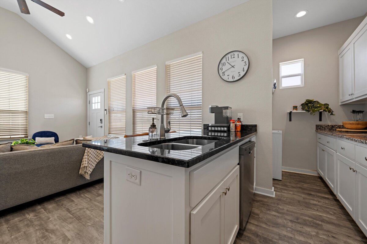 Fully stocked kitchen with island in this one-bedroom, one-bathroom vacation rental condo with free Wifi, free parking, and extra twin bed in downtown Waco, TX.