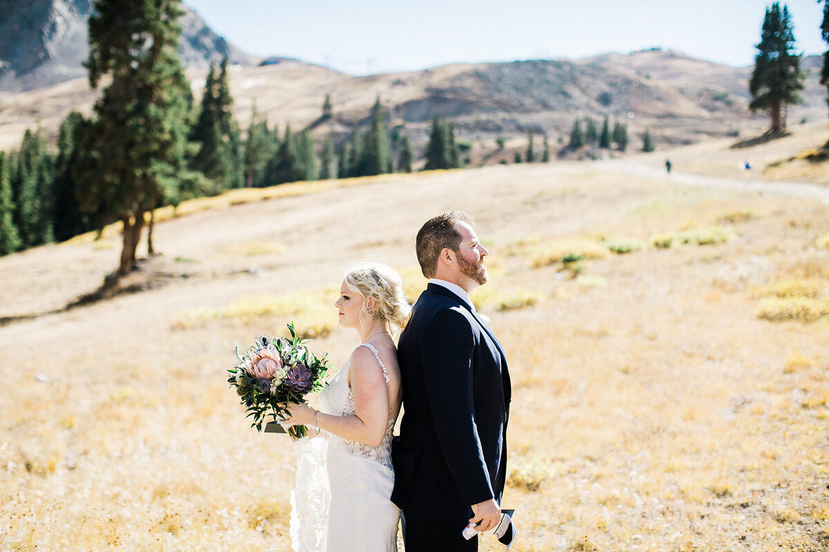 A destination wedding couple at Arapahoe Basin ski resort have their first look