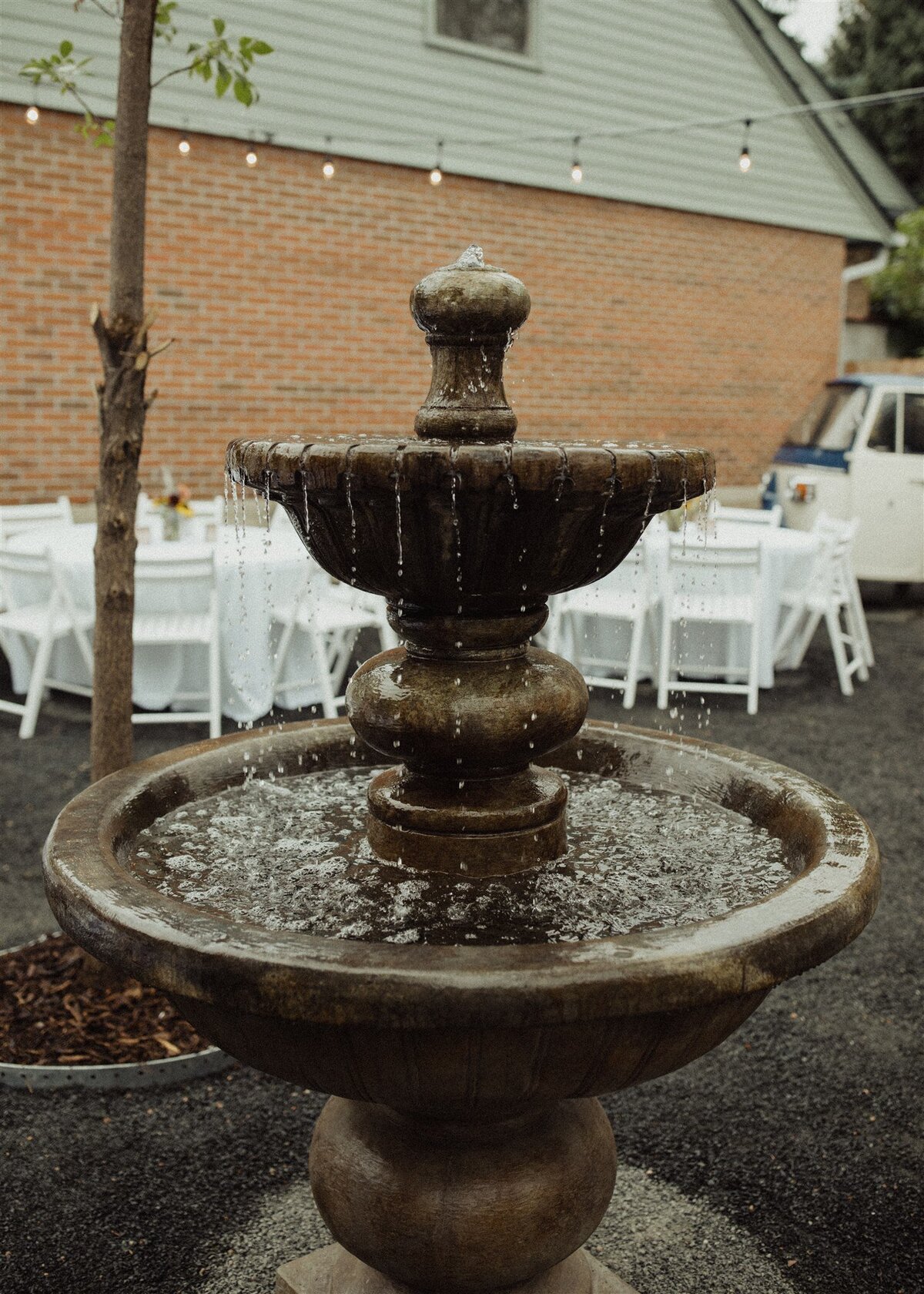 Water fountain at rehearsal dinner at the Terry Guesthouse, a micro wedding venue at historic home in Longmont, Colorado