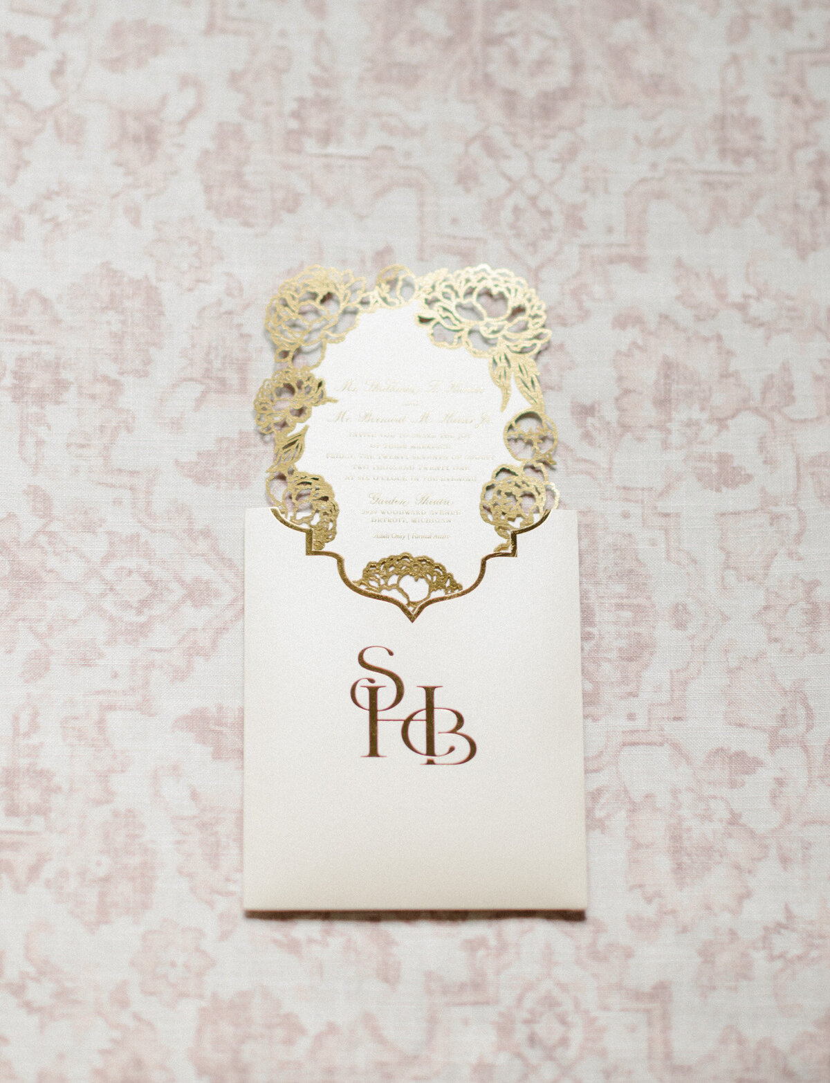 wedding stationery with custom crest and gold foil detail captured by Michigan film wedding photographer Christina Harrison