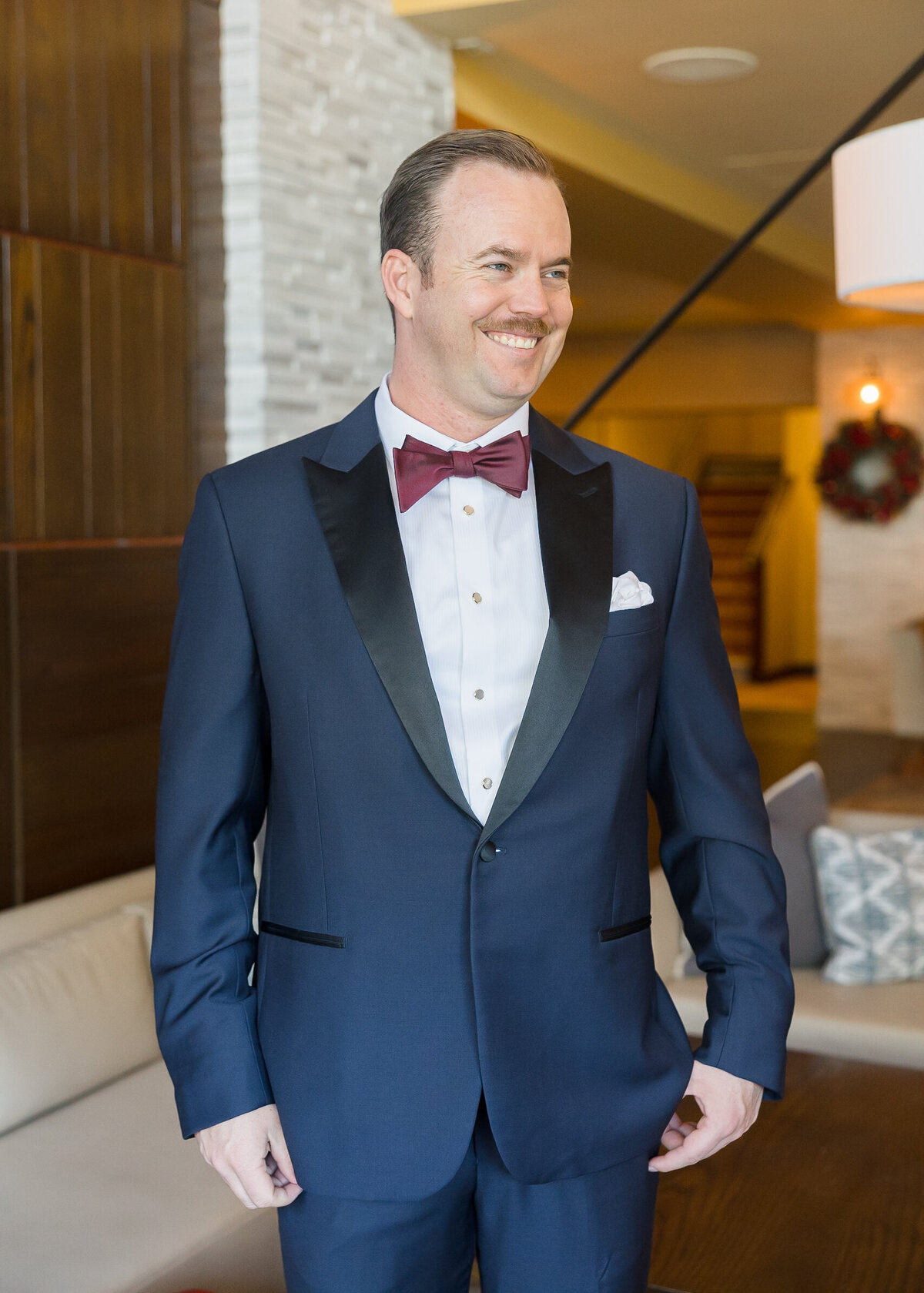 photo of the groom in a monterey hotel lobby