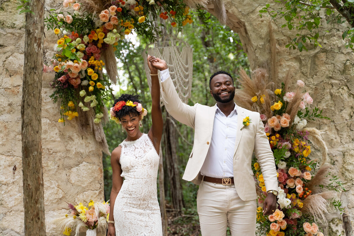 Couple just married in Bali and excited with beautiful tropical flowes