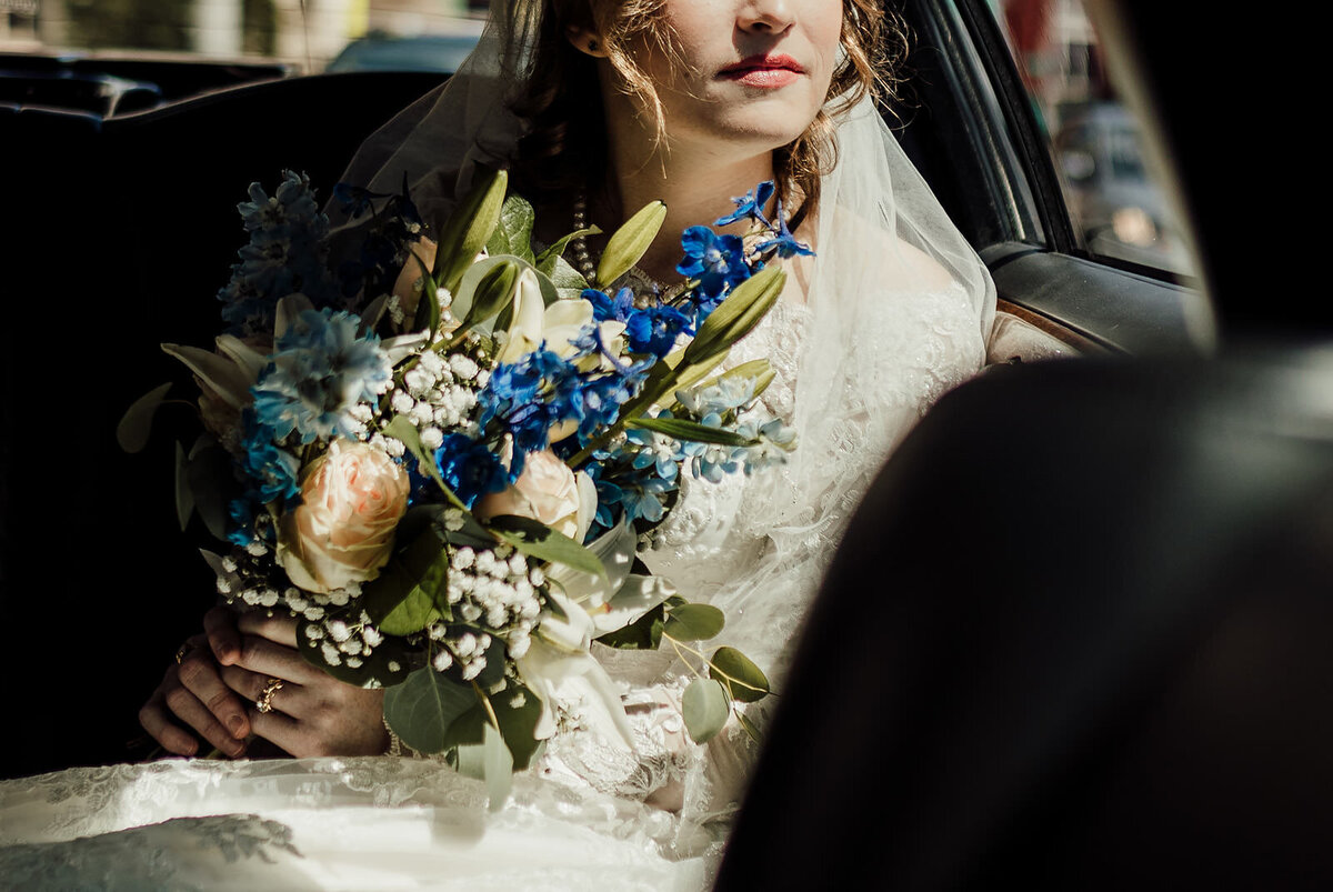 Close up of bride as she rides to her wedding ceremony