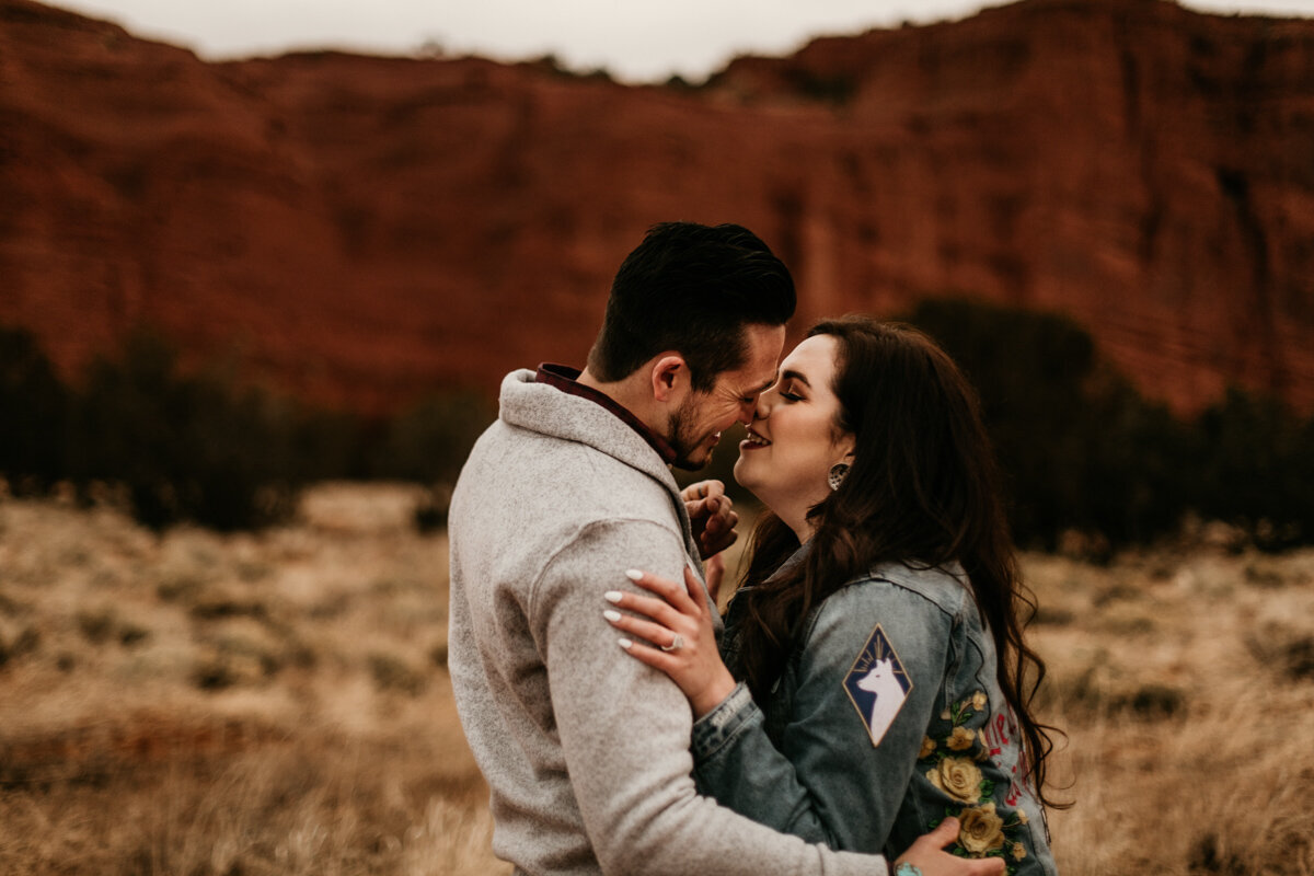 couple about to kiss in the desert