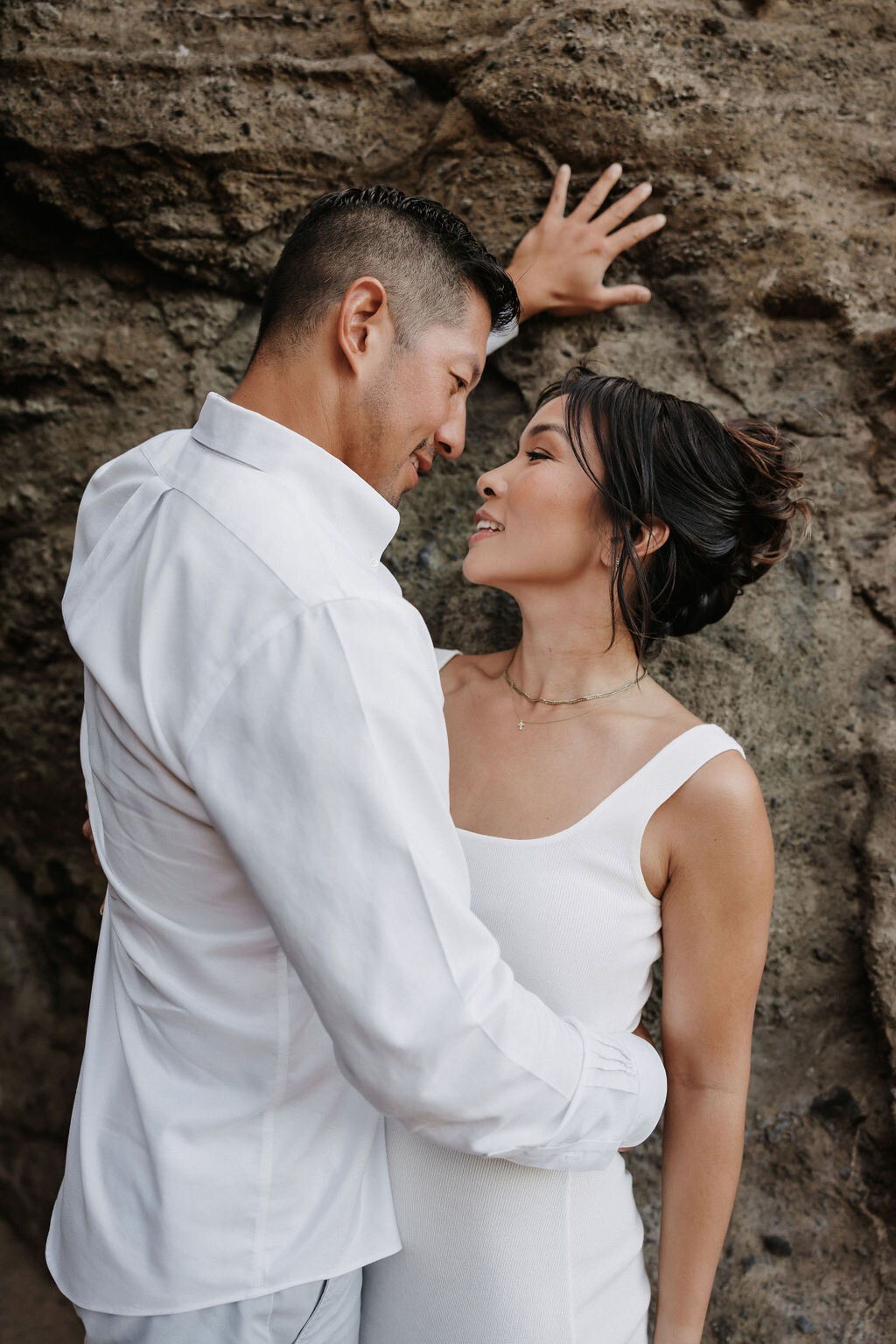 Romantic couples pose at Holana Blowhole in Honolulu by hawaii wedding photographer
