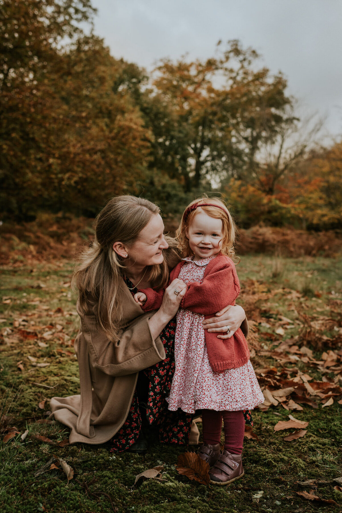 Mother and daughter in autumn coats