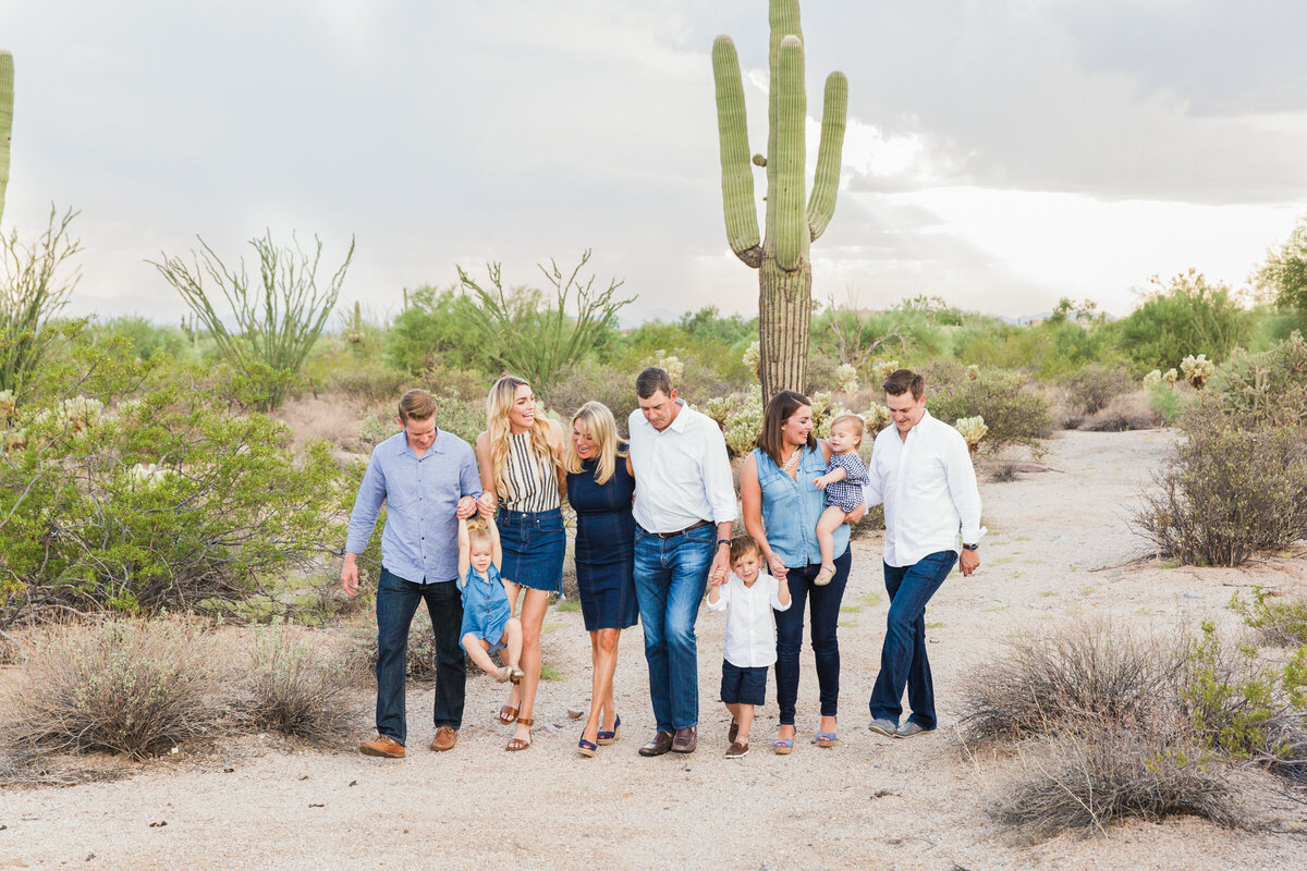 family smiling and walking together in Scottsdale desert
