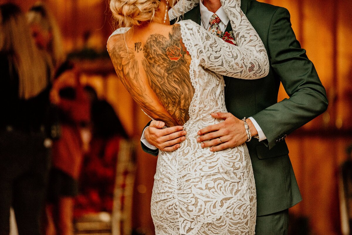 a groom holding his bride