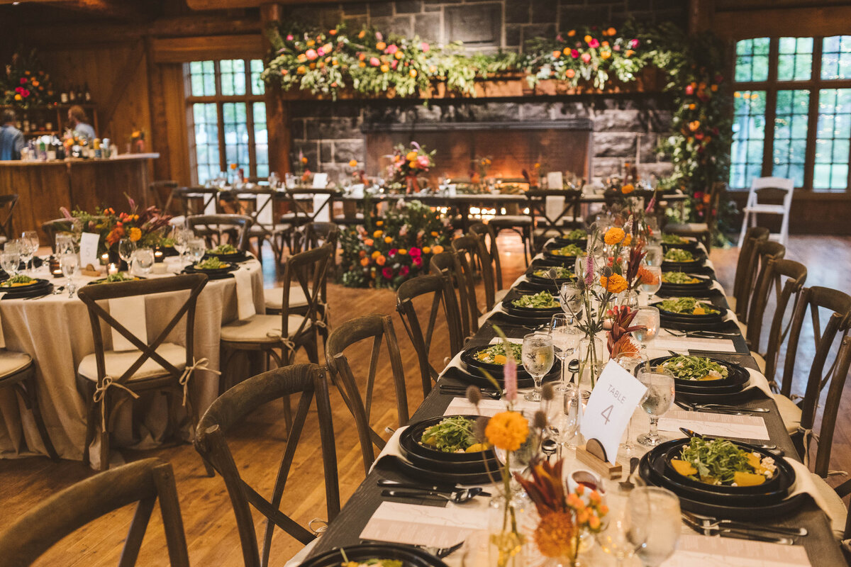 Guest tables with floral bud vases  and candles at Great Hall in Sunriver