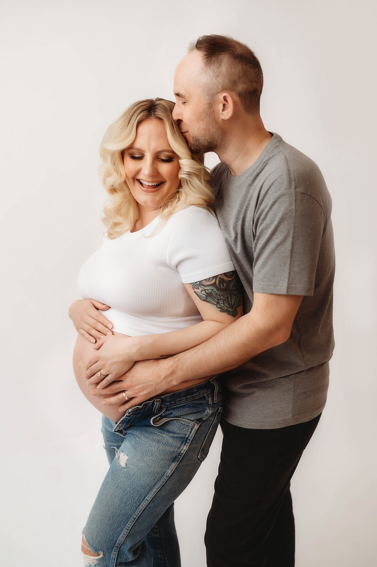 Expectant parents pose for Studio Maternity Photos in Charleston, SC.