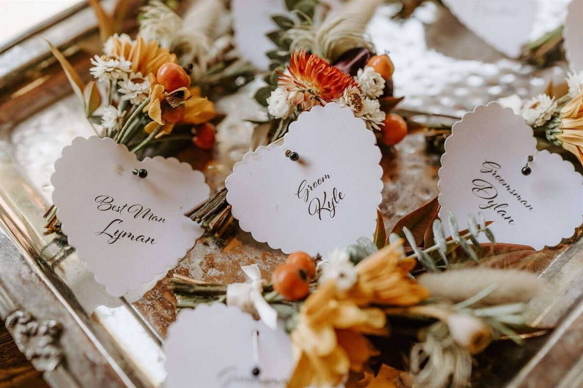 Personal flowers with name tags for wedding party.