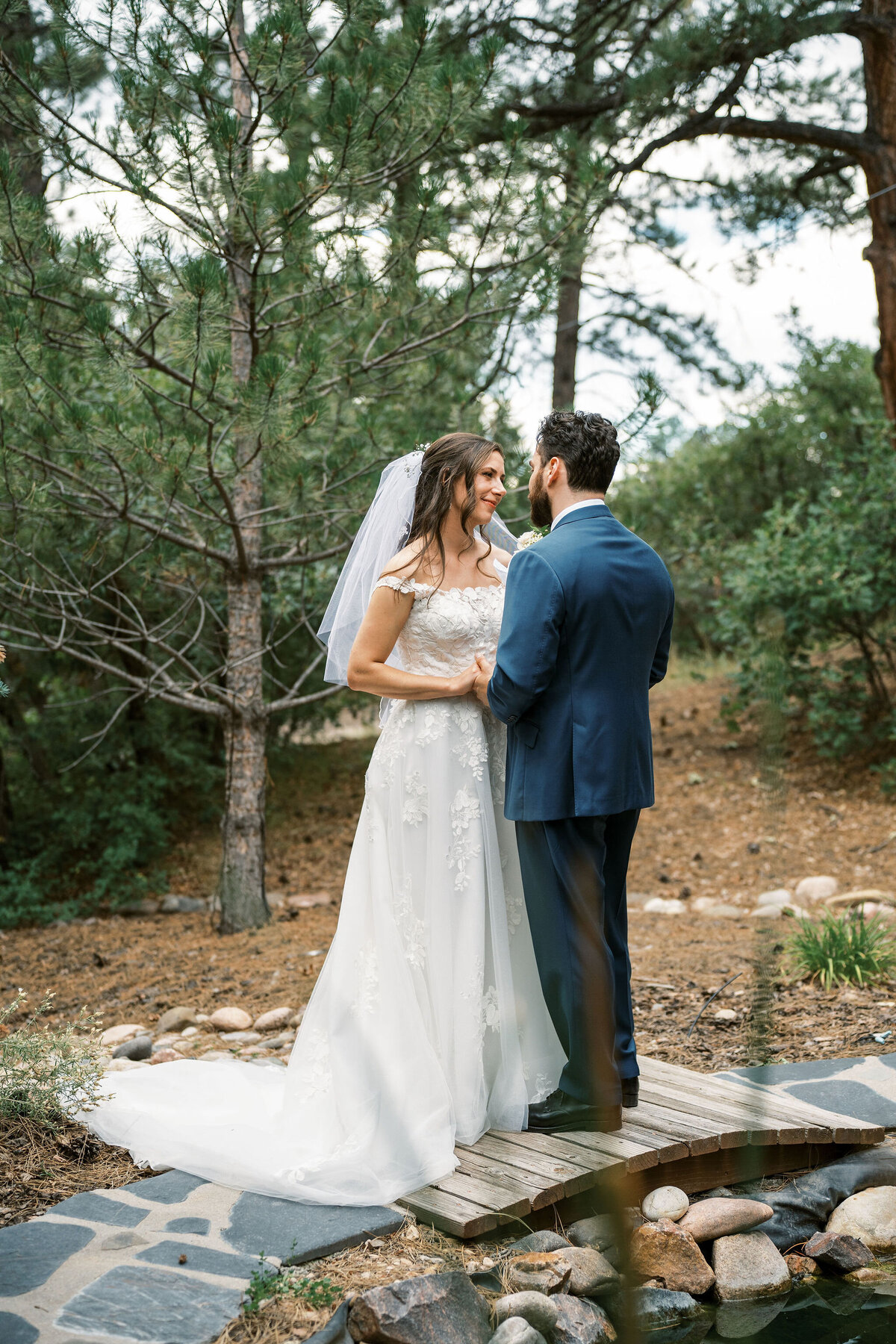 bride and groom talk during first look