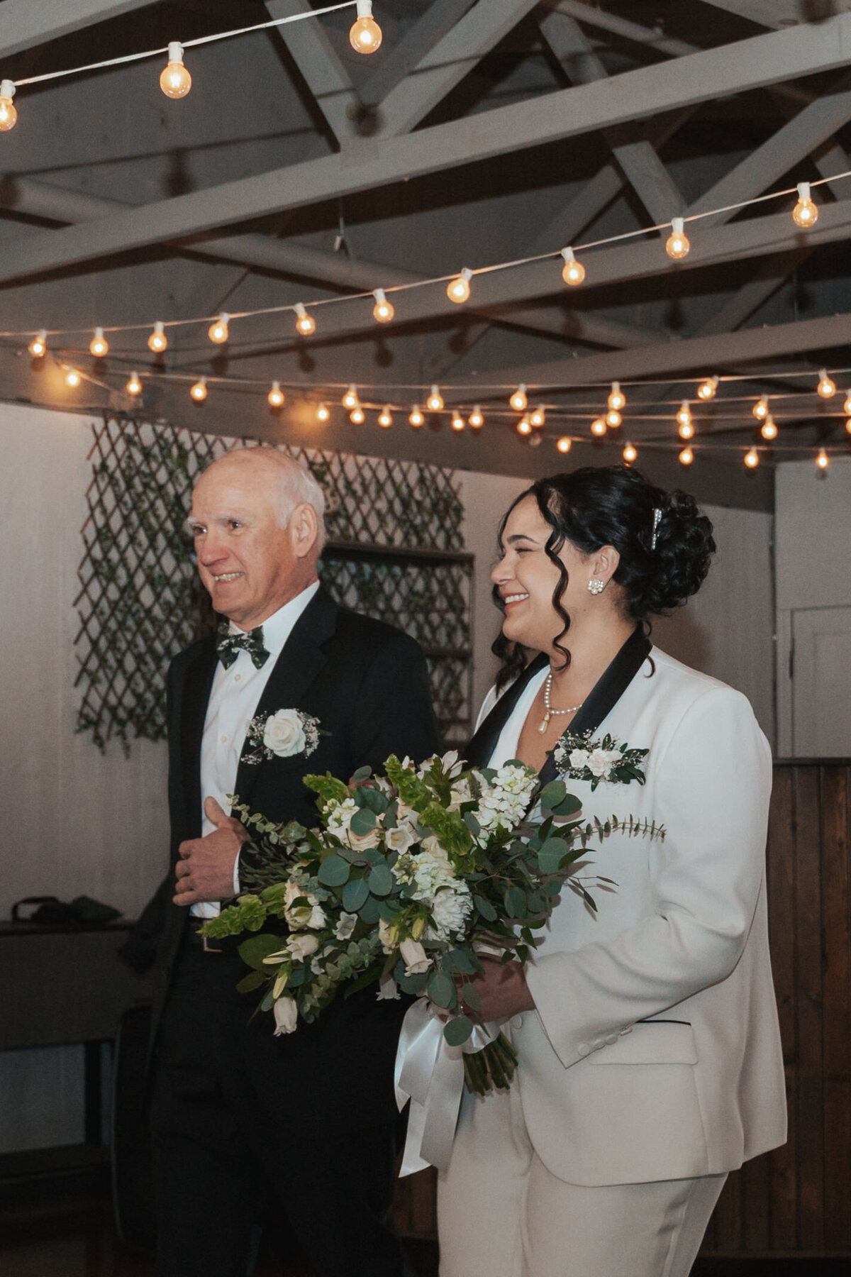 Bride walks down the aisle with their father 