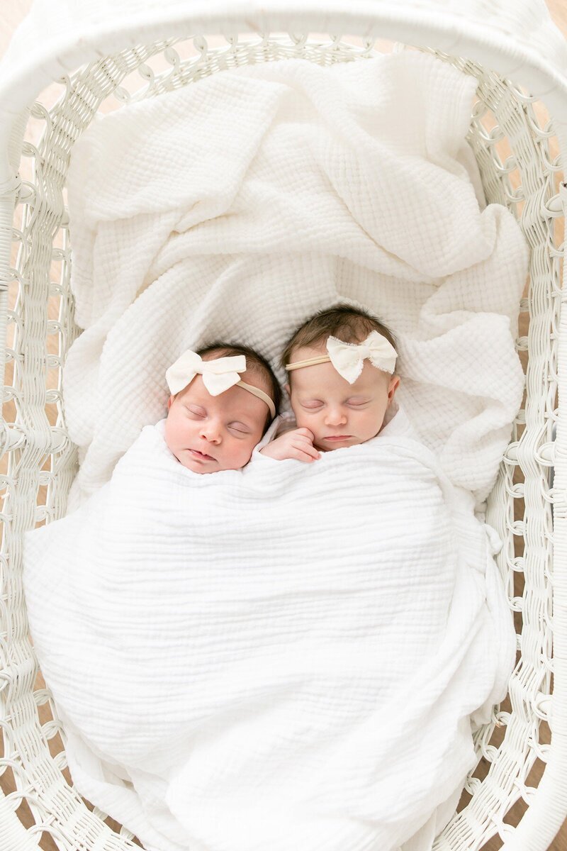 Newborn twin girls swaddled together in Savannah, GA photography session