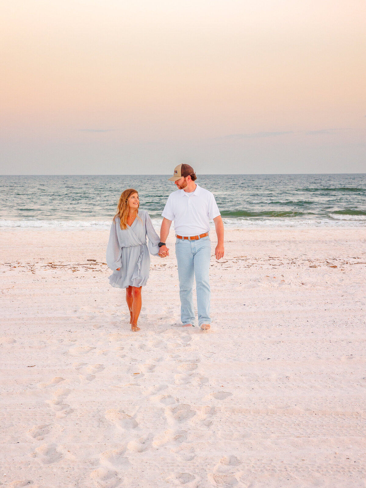 carefree couple enjoying beach vacation photos