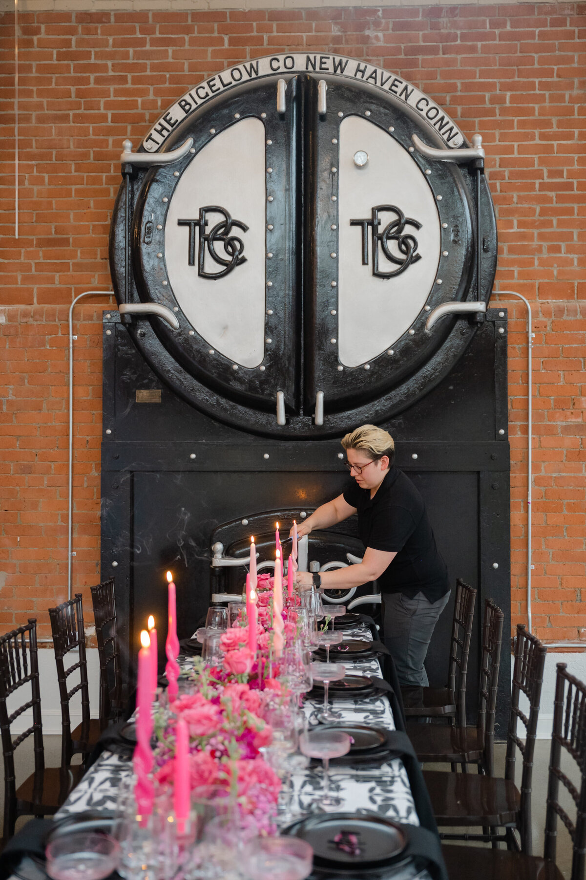 Amy designing a black and pink wedding tablescape