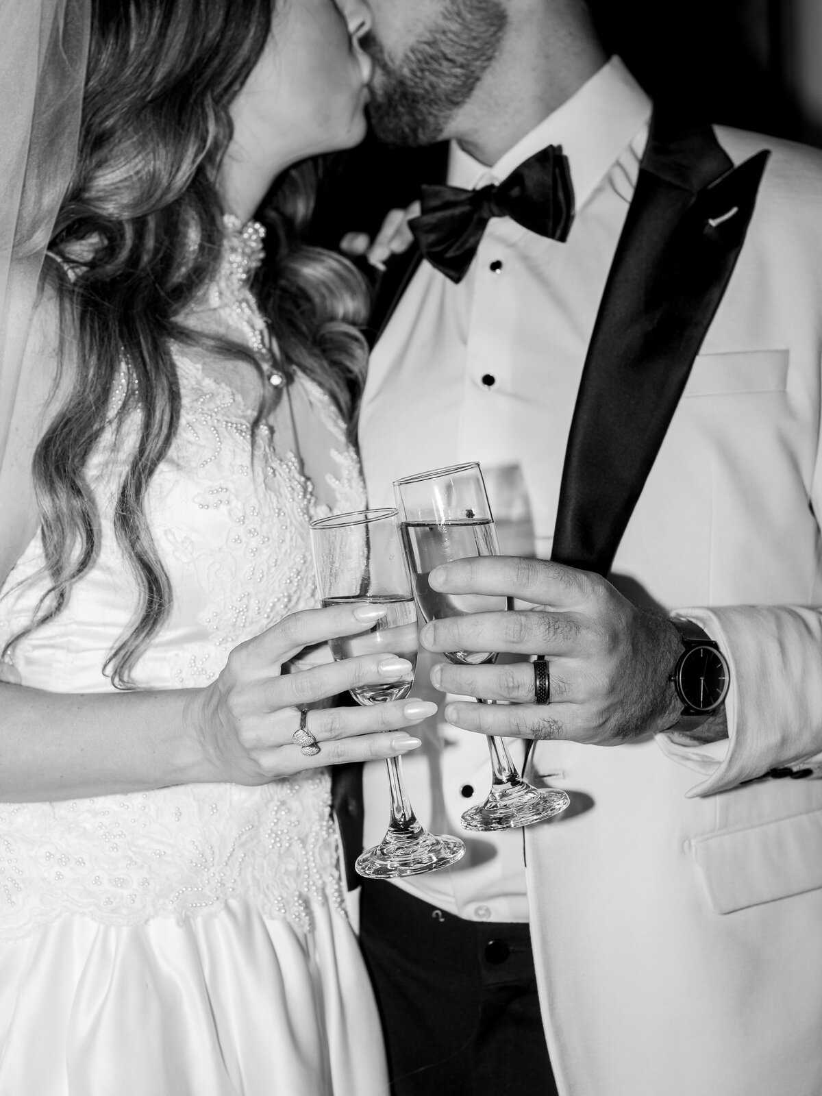 bride-groom-toast-wedding-kiss-black-and-white-photo-philadelphia.jpg