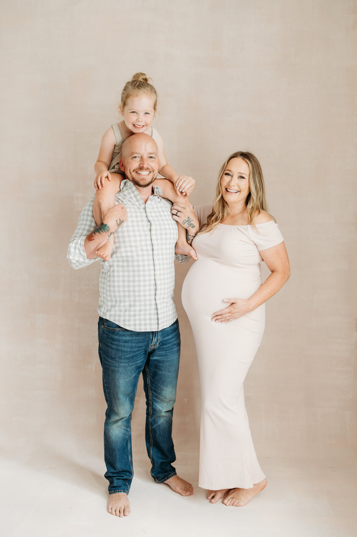 Dad with Pregnant Mom and their daughter