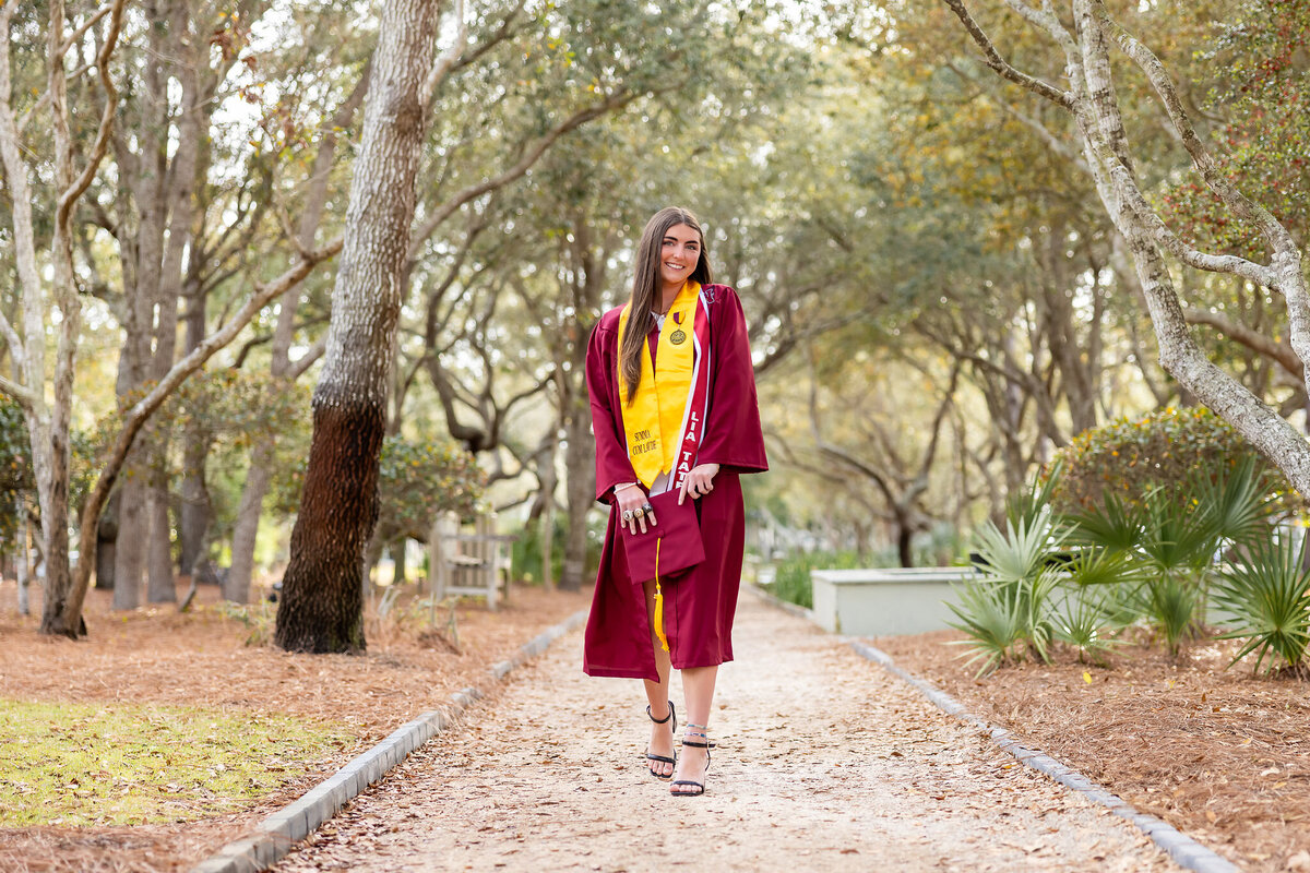 cap and gown portrait of a local senior at niceville high school.  Photo taken at Watercolor, FLorida, by Gwyne Gray Photography