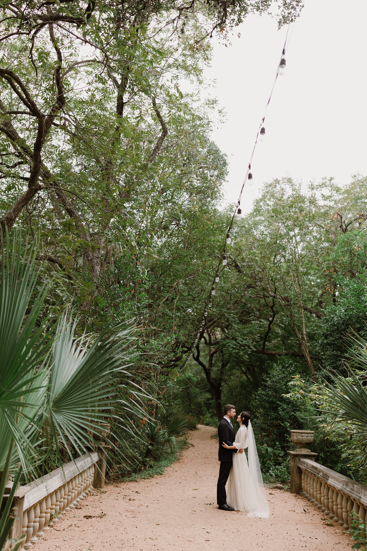 Bride and groom in the grounds of Laguna Gloria, Austin