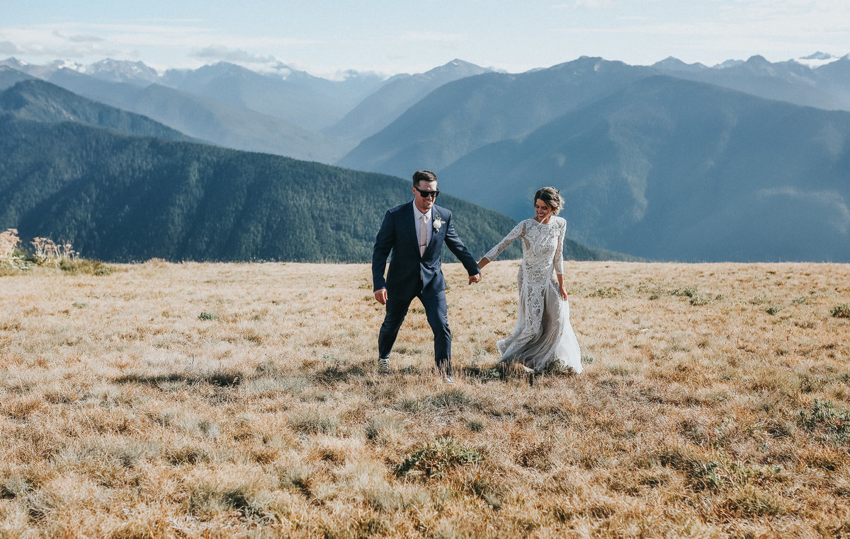 Hurricane Ridge elopement with bride and groom portrait with mountains in the background.