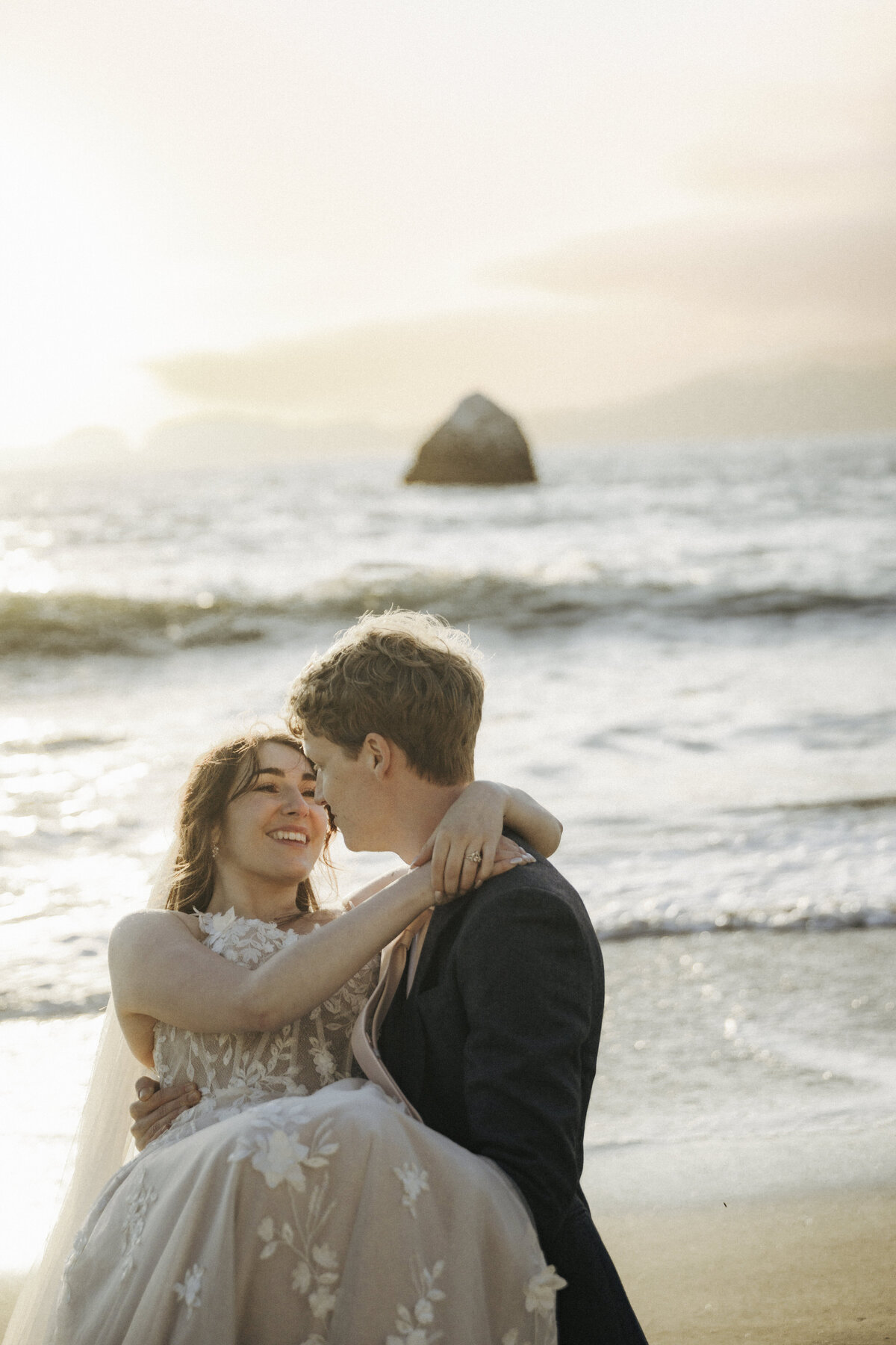 Bride and Groom at Marshall's Beach in San Francisco, California at sunset