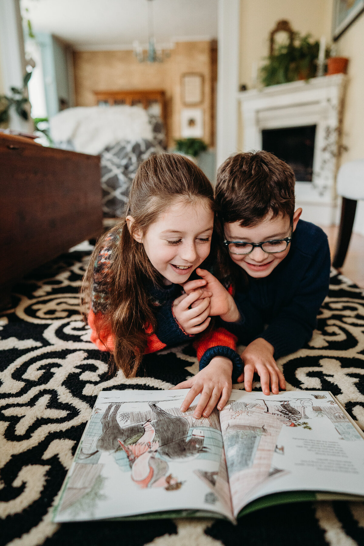 kids smile together while reading a book