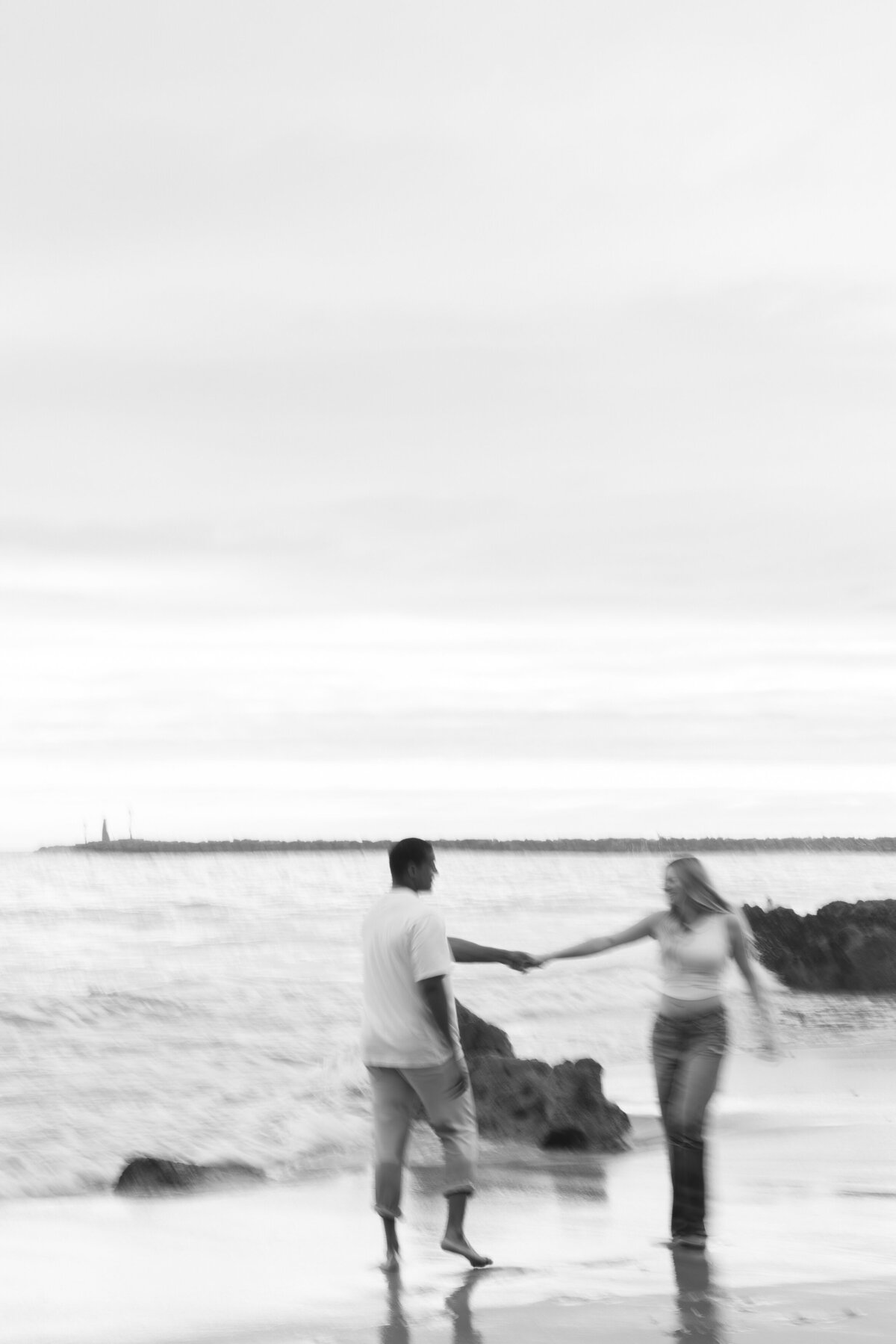 moody and artistic maternity photo on the beach