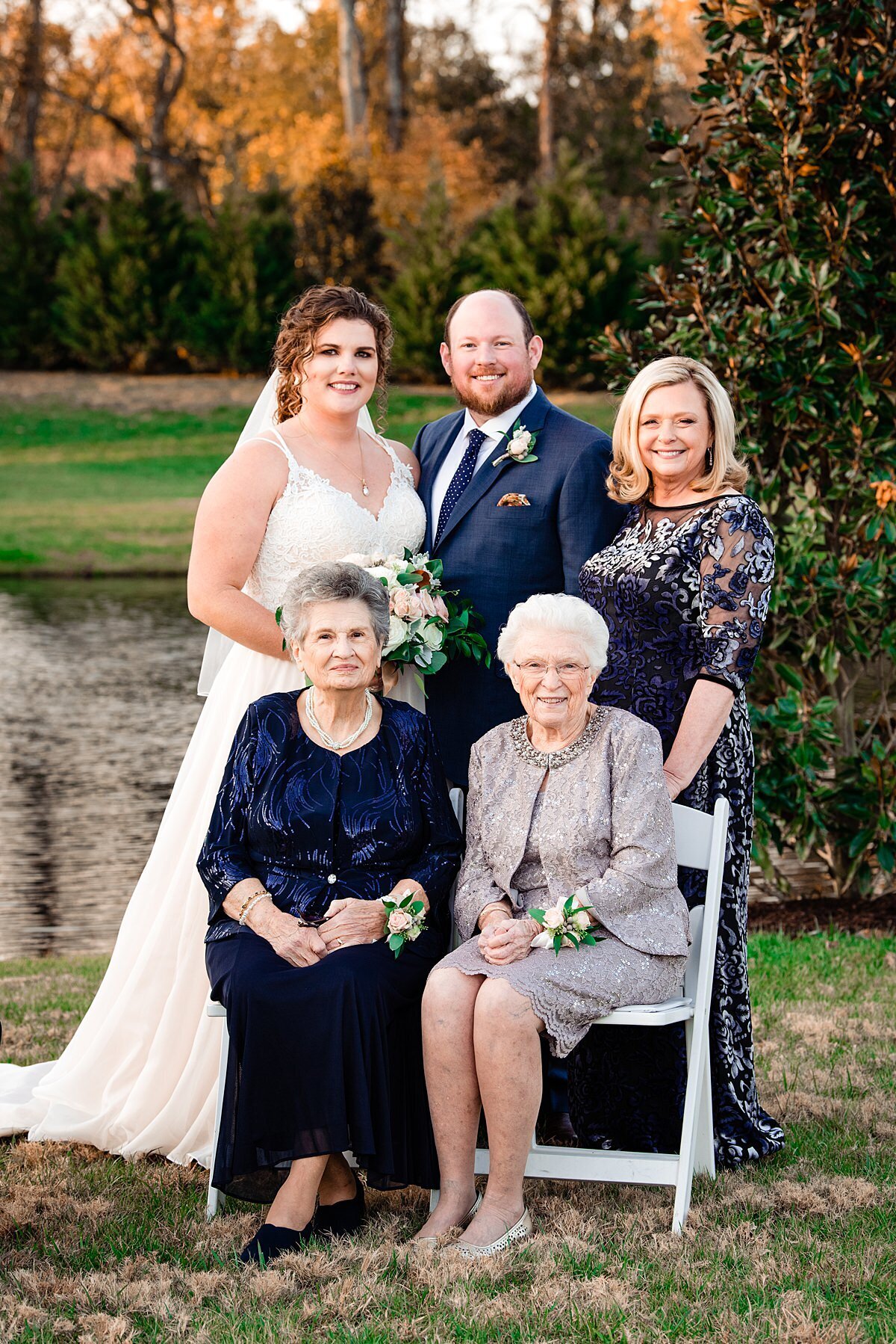 bride and groom with mother and grandmothers