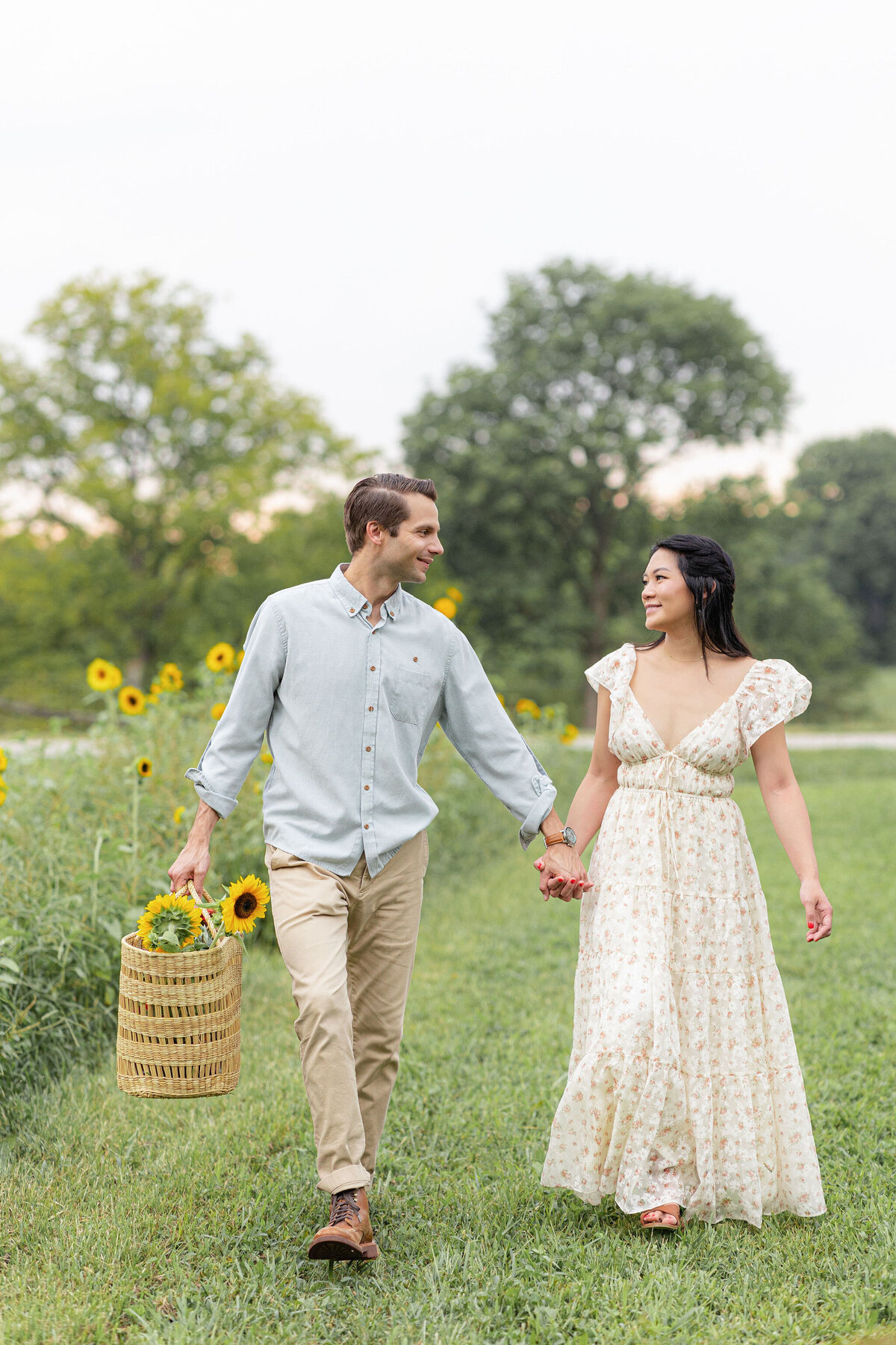 couple walking at Chickapoo farm for family session
