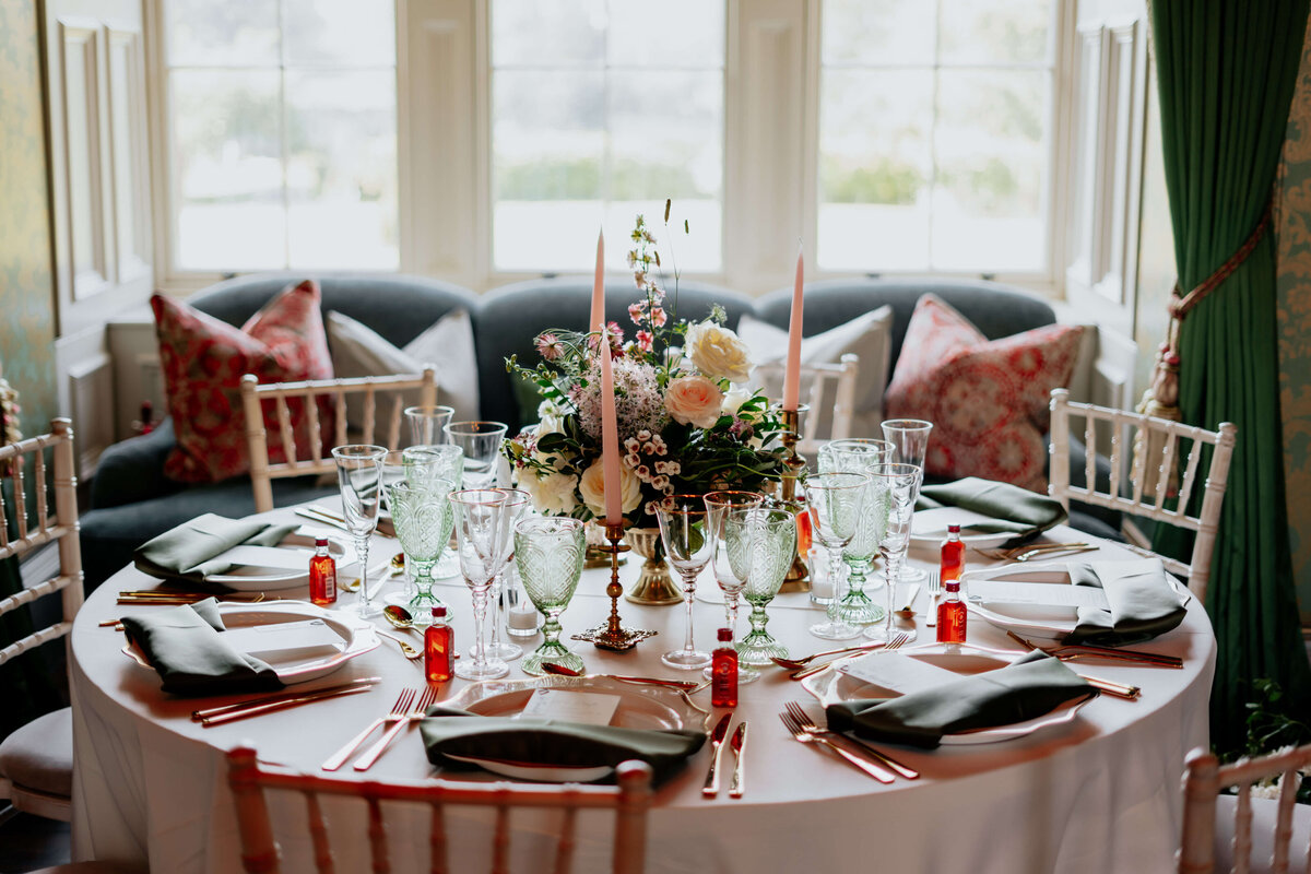 A beautifully styled table with pinks and greens