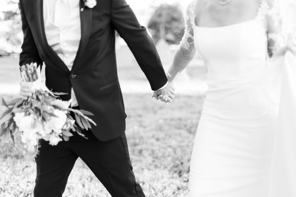 Bride and groom holding hands at The Carrick House Wedding venue in Lexington, KY