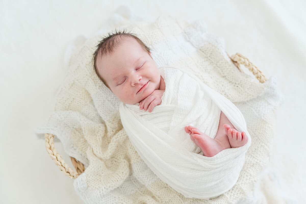 Light and neutral baby boy in home lifestyle newborn photos colorado elena spraguer photography 0049