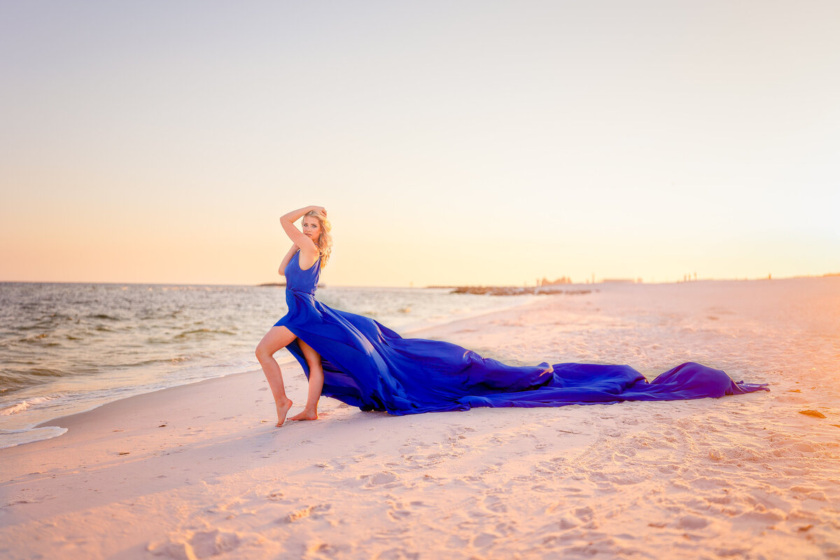 Gorgeous photos of a girl wearing a flying dress on the beaches of Alabama.  
