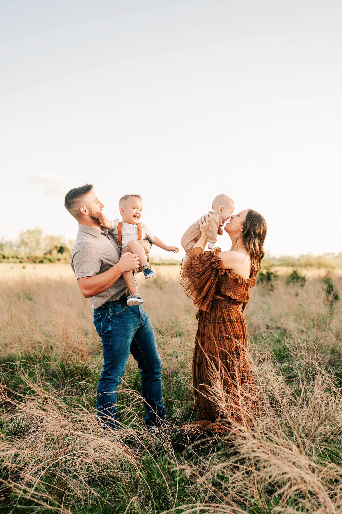 family playing and laughing enjoying Springfield MO family photography session