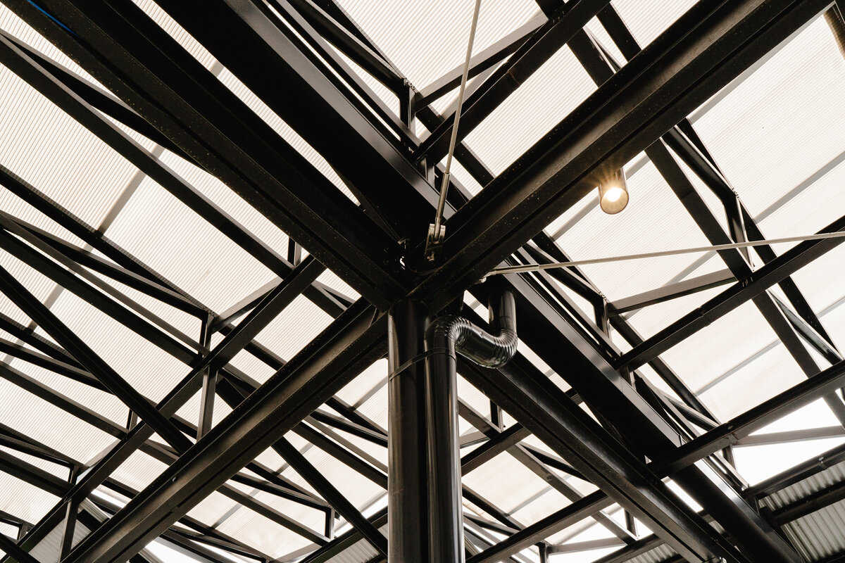 black steel shade structure meeting column