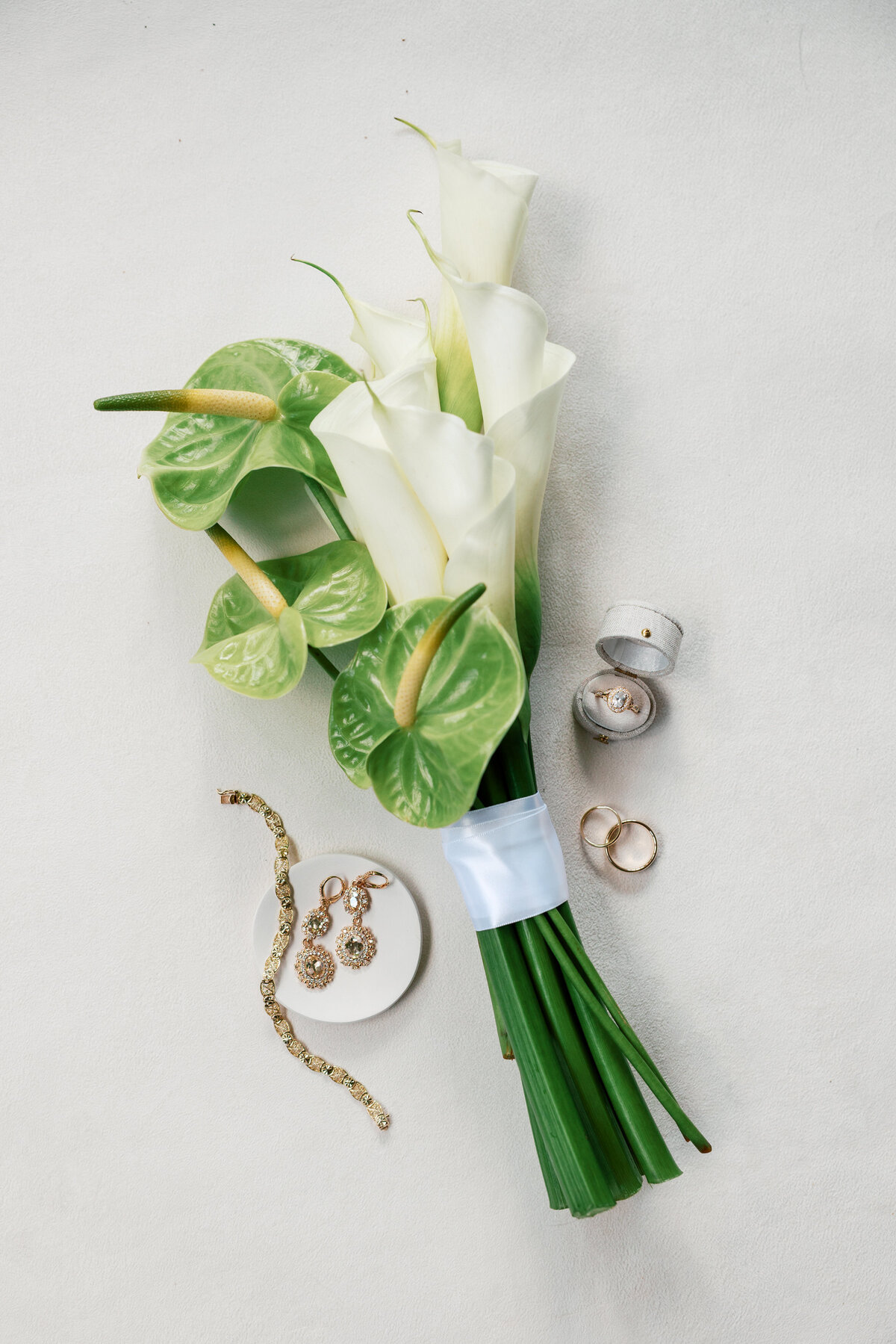 Elegant wedding bouquet with calla lilies and anthuriums, photographed in Dayton by a Philadelphia wedding photographer.