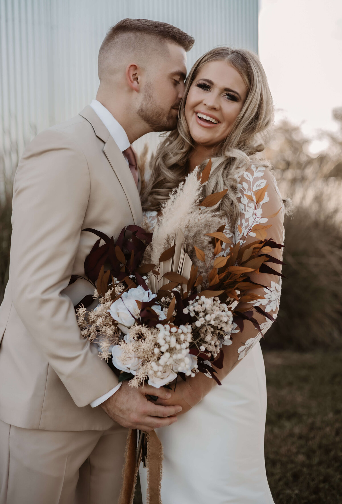 Fall bride with full glam makeup and voluminous curls, styled by wedding hair and makeup artists in San Antonio, TX