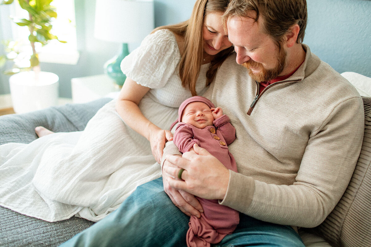 Intimate close-up of parents with newborn baby - Sara James creates detailed family portraits and emotional newborn storytelling through tight compositions during San Antonio Texas home photography sessions