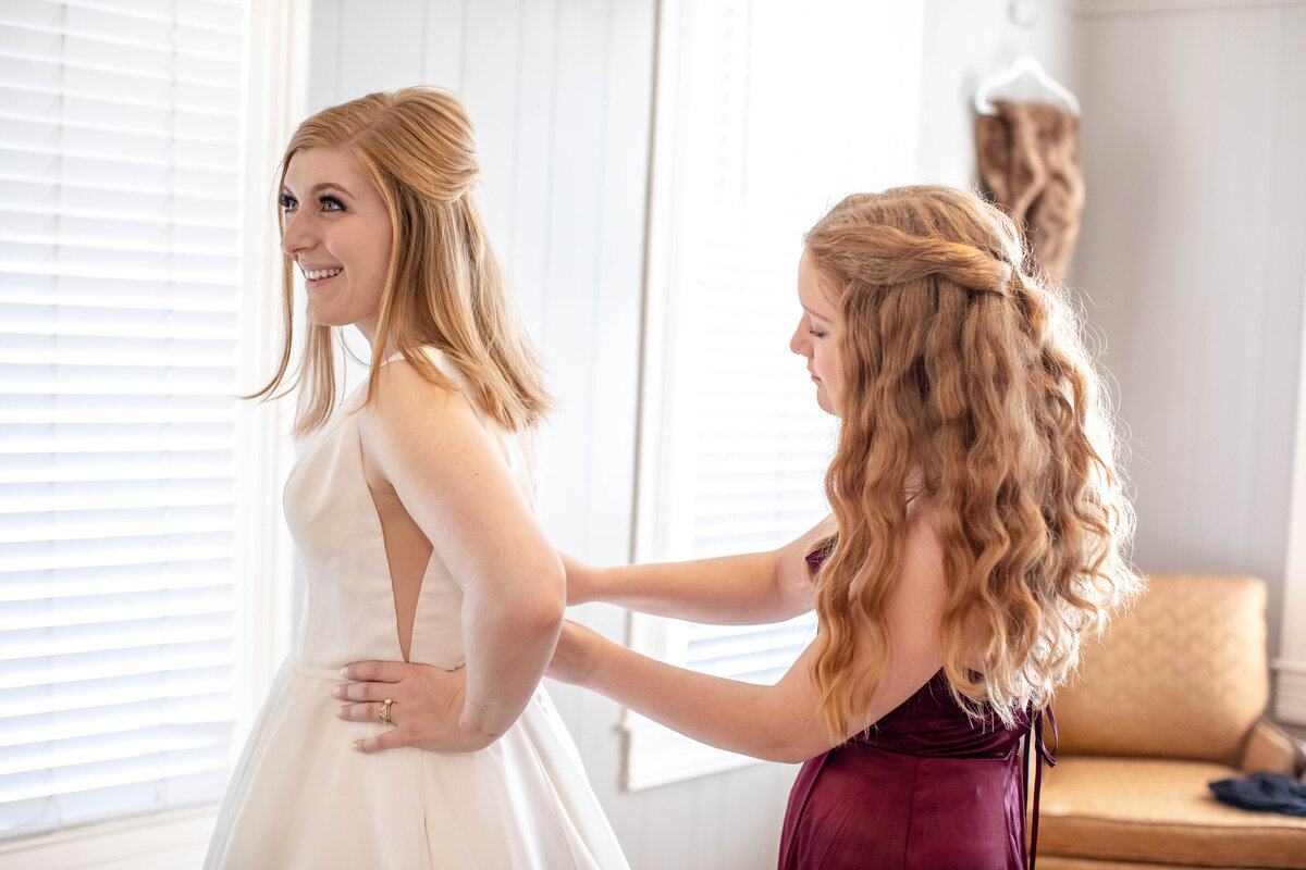 sister of bride buttons wedding dress  at Allen Farmhaus in New Braunfels Texas