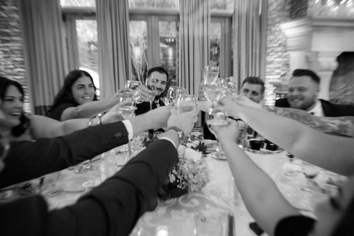 Friends cheers after toasts during the wedding reception in New York. 