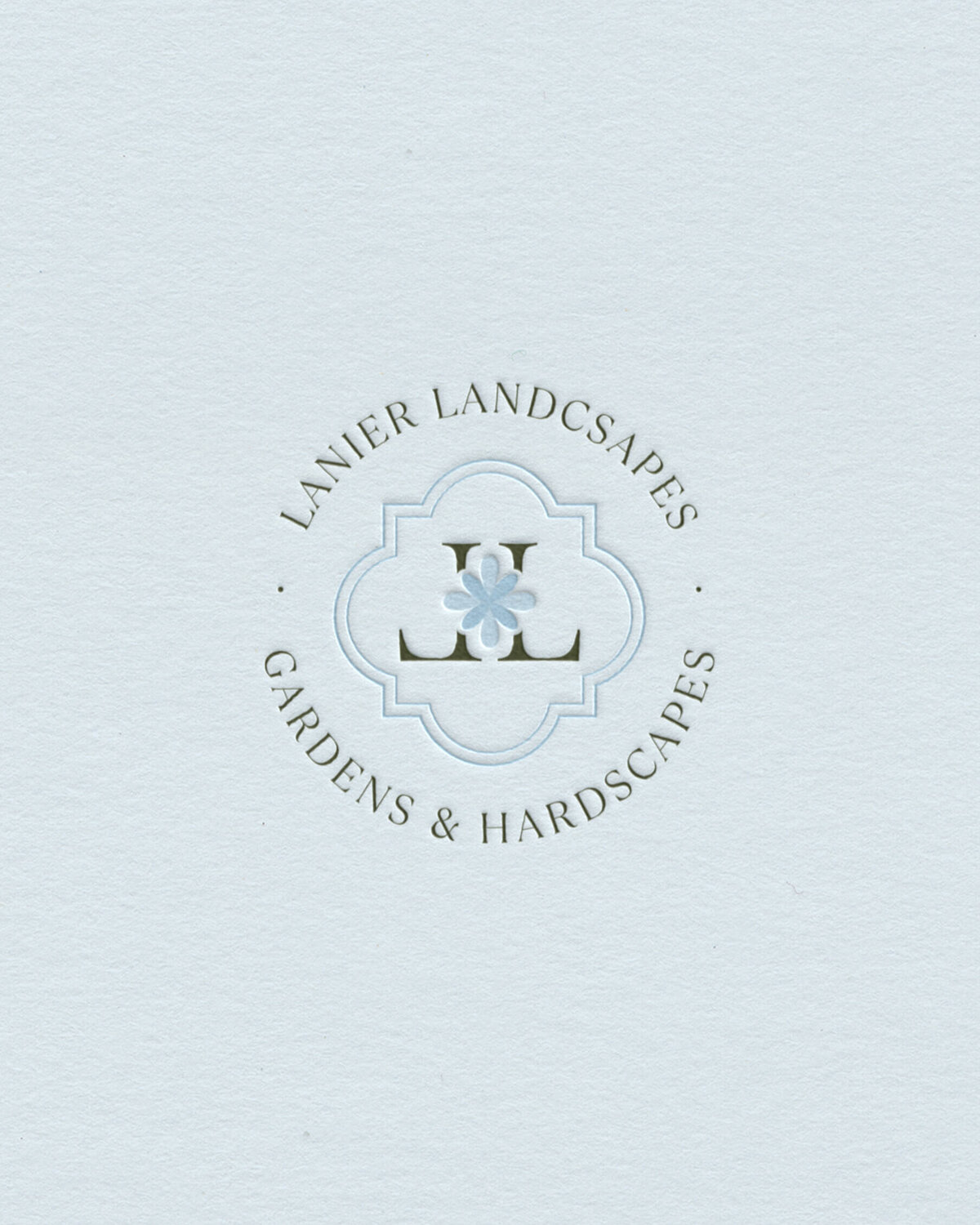 Delicate monogram logo in soft blue for nature-inspired brands, strategically designed for garden designers and boutique landscaping studios.