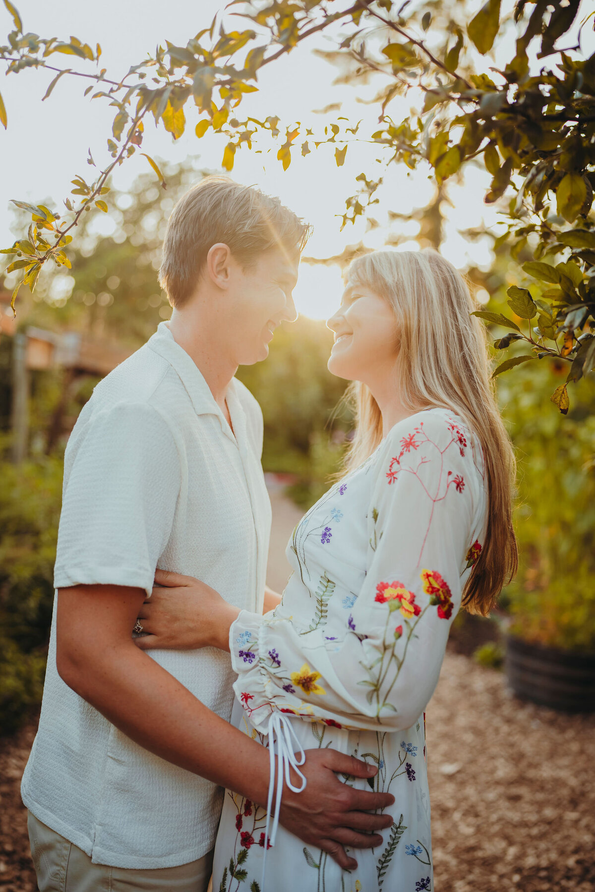 an engaged couple about to kiss
