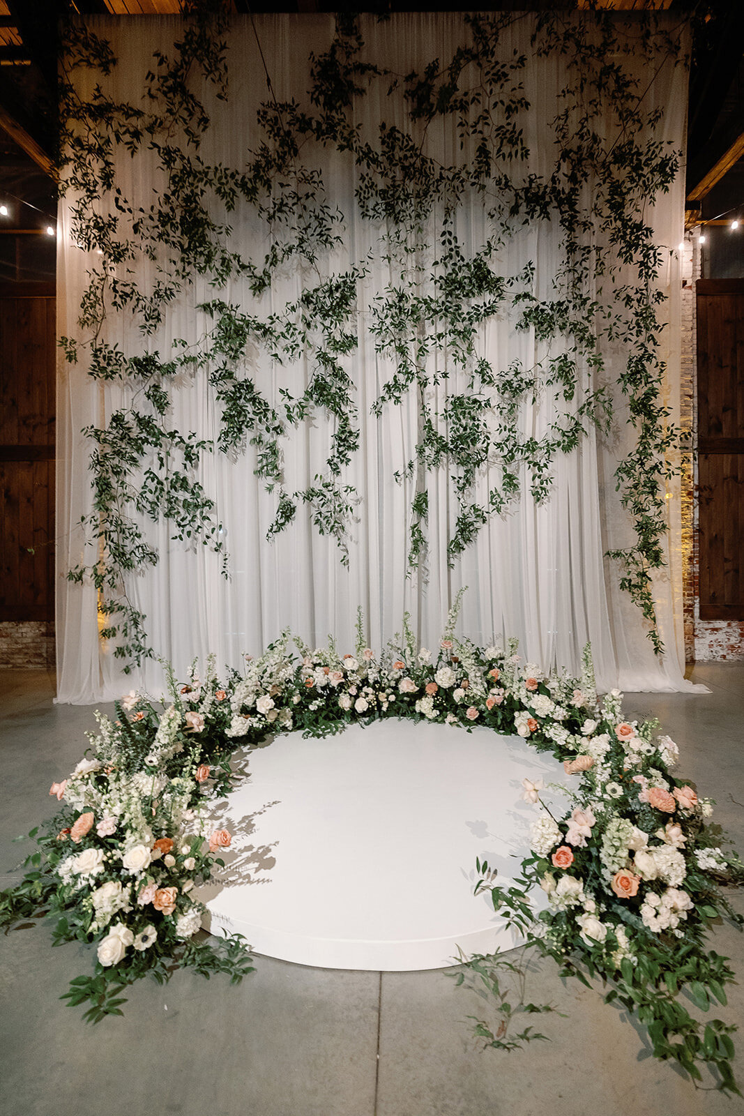 Kate-Murtaugh-Events-warehouse-wedding-planner-ceremony-stage-flowers
