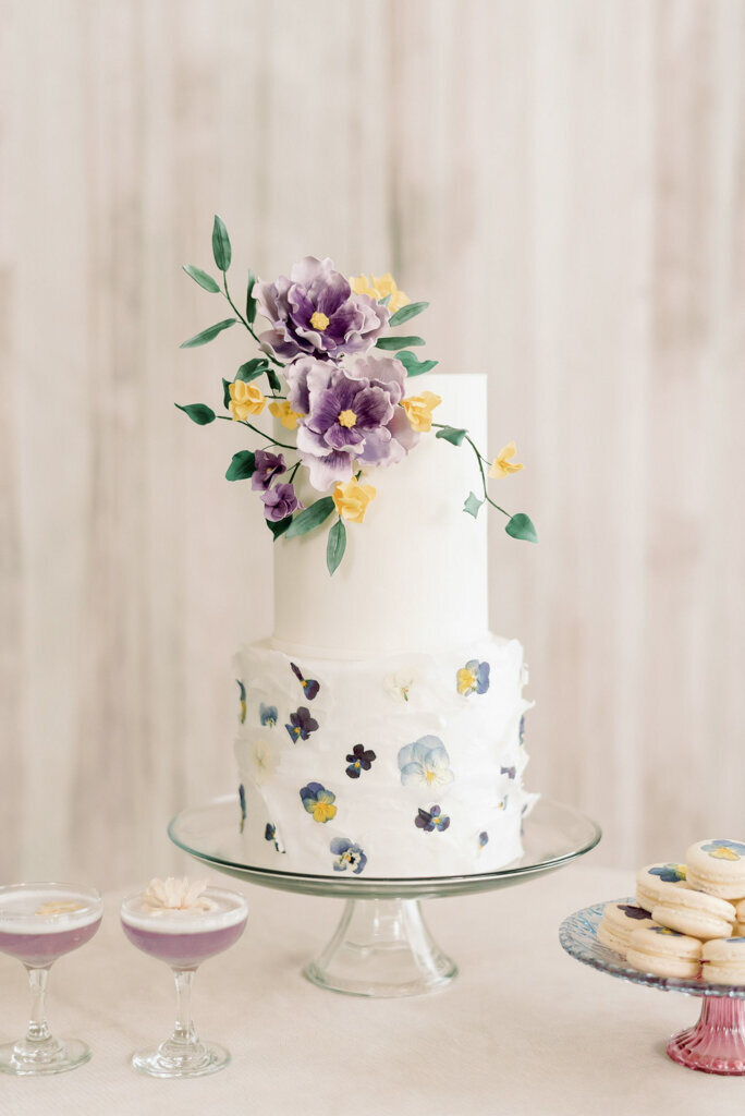 Spring inspired 3-tier wedding cake with lavender florals by Bake My Day, contemporary cakes & desserts in Calgary, Alberta, featured on the Brontë Bride Vendor Guide.