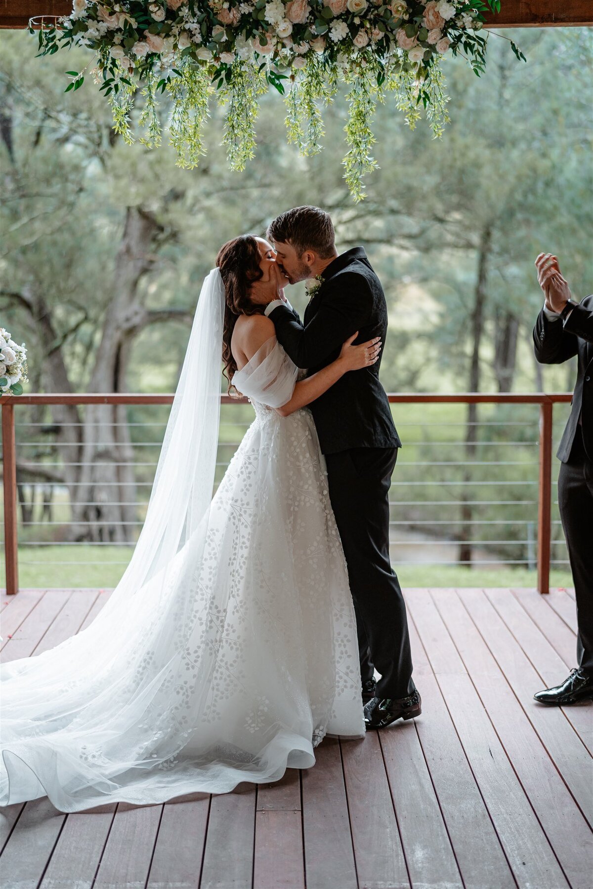 A couple shares their first kiss as husband and wife during the ceremony.