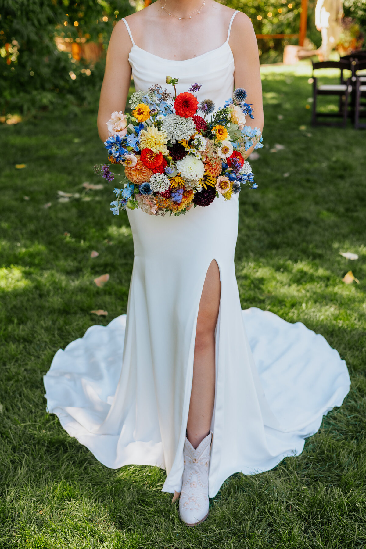 A bride shows off her bouquet during her wedding at Lyons Farmette in Lyons, Colorado.