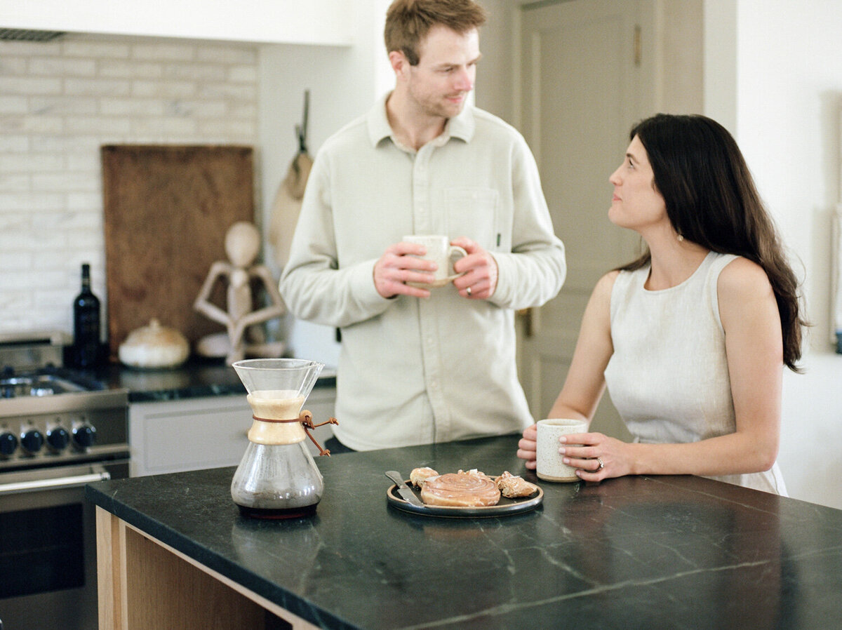 designer has coffee with her husband at Fernhaus, lifestyle film interior photography, designer brand photos