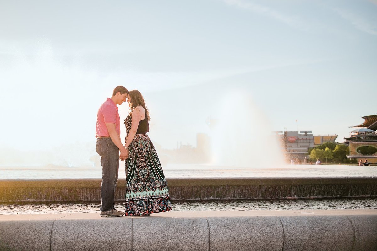 Engagement session image in front of the fountain at Point State Park in Pittsburgh, PA