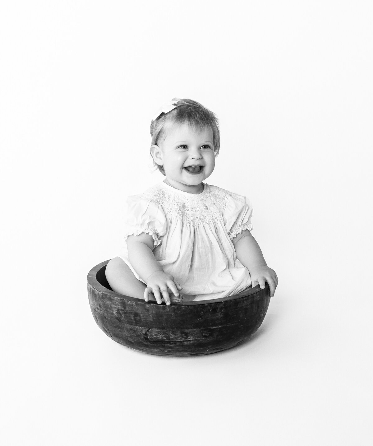 Girl sitting in bowl during family photoshoot with Mount Juliet, TN photographer